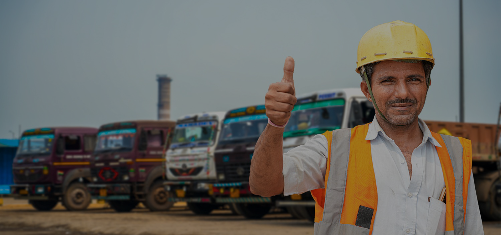 a truck driver showing thumbs up